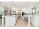Bright kitchen featuring a large island with white countertops, modern appliances, and ample cabinet space at 13556 Abberwick Dr, Orlando, FL 32832