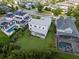 Aerial view of the property showing its location, large backyard, neighboring houses, and landscaping at 14124 Eliot Ave, Orlando, FL 32827