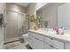 Sleek bathroom with a glass-enclosed shower, modern vanity, and neutral color palette at 14124 Eliot Ave, Orlando, FL 32827