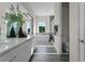 Contemporary bathroom with double vanity, soaking tub, walk-in shower, and bright natural light at 14124 Eliot Ave, Orlando, FL 32827
