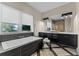 Luxurious bathroom featuring a soaking tub, double vanity, and modern fixtures at 14124 Eliot Ave, Orlando, FL 32827