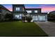 Modern two-story home featuring a well-manicured lawn and a two-car garage at 14124 Eliot Ave, Orlando, FL 32827
