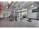 Bright gym featuring modern weightlifting equipment and a wall-mounted television at 14124 Eliot Ave, Orlando, FL 32827