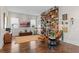 Cozy living room with hardwood floors, built-in bookshelves, and a comfortable seating area at 14124 Eliot Ave, Orlando, FL 32827