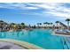 Large pool area features chaise lounges, cabanas, and palm trees, creating a resort-like atmosphere at 14124 Eliot Ave, Orlando, FL 32827