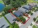 Aerial view of a home showing the backyard with a pergola, landscaping, and proximity to nearby houses at 14193 Gold Bridge Dr, Orlando, FL 32824