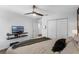 Bedroom with wood-look flooring, closet with doors, and bed with decorative pillows and blanket at 14193 Gold Bridge Dr, Orlando, FL 32824