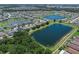 Expansive aerial view showcasing the community's homes, lakes, and green spaces, highlighting the neighborhood's layout at 14193 Gold Bridge Dr, Orlando, FL 32824