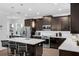Contemporary kitchen featuring stainless steel appliances, island, and ample cabinet space at 14193 Gold Bridge Dr, Orlando, FL 32824