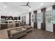 Open living room showcasing a kitchen, large sectional sofa, and bright windows at 14193 Gold Bridge Dr, Orlando, FL 32824