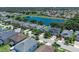 Aerial image of a neighborhood by a lake, displaying the layout and streetscape on a sunny day at 14193 Gold Bridge Dr, Orlando, FL 32824