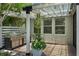 Outdoor grill area with stainless steel grill and decorative plants at 14193 Gold Bridge Dr, Orlando, FL 32824