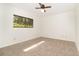 Carpeted bedroom featuring a ceiling fan, bright window, and neutral paint at 1424 Mt Laurel Dr, Winter Springs, FL 32708