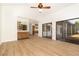 Open living space with wood-look floors, a wet bar, and sliding glass doors, perfect for entertaining and relaxation at 1424 Mt Laurel Dr, Winter Springs, FL 32708