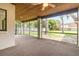 Spacious screened porch with ceiling fan, carpet flooring, and views of the backyard at 1424 Mt Laurel Dr, Winter Springs, FL 32708