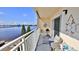 Cozy balcony with nautical décor, comfortable seating, and scenic water views, creating a relaxing outdoor space at 145 N Halifax Ave # 705, Daytona Beach, FL 32118