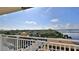 Balcony with expansive views of the surrounding cityscape, bay, and blue skies, a perfect retreat at 145 N Halifax Ave # 705, Daytona Beach, FL 32118