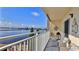 Inviting balcony space with comfortable seating and stunning views of the water and sky at 145 N Halifax Ave # 705, Daytona Beach, FL 32118