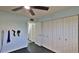 A bedroom offers plenty of closet space, providing ample room for storage and organization with easy access to an entryway at 145 N Halifax Ave # 705, Daytona Beach, FL 32118
