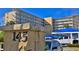 Harbor View condo exterior featuring a multi-story building with covered parking and views of the water at 145 N Halifax Ave # 705, Daytona Beach, FL 32118