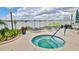 Inviting hot tub with lounge chairs overlooking waterfront in this condo neighborhood at 145 N Halifax Ave # 705, Daytona Beach, FL 32118