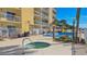 Inviting hot tub with tropical plants and building backdrop in this condo neighborhood at 145 N Halifax Ave # 705, Daytona Beach, FL 32118
