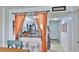 Charming kitchen view with bar seating, orange curtains and colorful backsplash creates an inviting space at 145 N Halifax Ave # 705, Daytona Beach, FL 32118