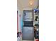 Compact laundry area with a stacked washer and dryer unit and space-saving design to help make laundry tasks a breeze at 145 N Halifax Ave # 705, Daytona Beach, FL 32118
