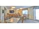 Bright recreation room with tables, chairs, and a large-screen TV for residents at 145 N Halifax Ave # 705, Daytona Beach, FL 32118