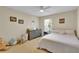 A neutral colored bedroom features toys and neutral furniture with a large window for plenty of natural light at 1461 Travertine Ter, Sanford, FL 32771