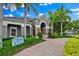 The Greystone Clubhouse features a welcoming facade with stone accents and lush landscaping at 1461 Travertine Ter, Sanford, FL 32771