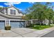 Attractive two-story home featuring an attached two-car garage and a well-maintained front yard at 1461 Travertine Ter, Sanford, FL 32771