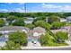 Beautiful home features a two-car garage, well-manicured lawn, and a serene pond view in a vibrant community at 1461 Travertine Ter, Sanford, FL 32771