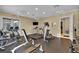 Well-equipped fitness center with treadmills, elliptical machines, and weightlifting equipment at 1461 Travertine Ter, Sanford, FL 32771