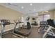 Modern fitness center featuring treadmills, elliptical, weight machines and ample mirror space at 1461 Travertine Ter, Sanford, FL 32771