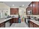 Spacious kitchen with stainless steel appliances, granite countertops and tile flooring at 1461 Travertine Ter, Sanford, FL 32771