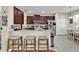 Kitchen with granite countertops, a breakfast bar, stainless steel appliances and tile floors at 1461 Travertine Ter, Sanford, FL 32771