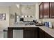 Open concept kitchen with stainless steel appliances and stone countertops at 1461 Travertine Ter, Sanford, FL 32771
