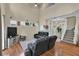 Large living room with vaulted ceiling, a staircase, and hardwood floors at 1461 Travertine Ter, Sanford, FL 32771
