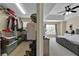 Main bedroom with walk in closet, carpet, neutral paint, and well lit from ceiling fan and large window at 1461 Travertine Ter, Sanford, FL 32771