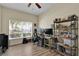 Well lit home office features hard wood floors, lots of natural light and a built in book shelf at 1461 Travertine Ter, Sanford, FL 32771