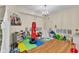 Spacious playroom features hardwood floors, a chandelier and plenty of natural light at 1461 Travertine Ter, Sanford, FL 32771