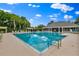 Large swimming pool offers a refreshing escape with a view of tropical landscaping and the community at 1461 Travertine Ter, Sanford, FL 32771