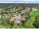 Aerial view of neighborhood featuring lake, lush landscaping, and mature trees at 1462 Palm Bay Ct, Lake Mary, FL 32746