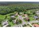 Aerial view of neighborhood featuring lake, lush landscaping, and mature trees at 1462 Palm Bay Ct, Lake Mary, FL 32746