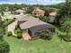 Aerial view showing the house in a cul-de-sac with circular driveway at 1462 Palm Bay Ct, Lake Mary, FL 32746
