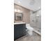 Updated bathroom featuring gray vanity with elegant countertop and sleek glass enclosed shower with gray tile at 1462 Palm Bay Ct, Lake Mary, FL 32746