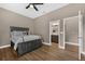 Relaxing bedroom features a dark wood bed set and a ceiling fan at 1462 Palm Bay Ct, Lake Mary, FL 32746