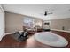 Bonus room with ample space, dual seating, and a dedicated workout corner, flooded with natural light at 1462 Palm Bay Ct, Lake Mary, FL 32746