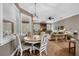Open dining area with a round table, lots of natural light, and wood flooring at 1462 Palm Bay Ct, Lake Mary, FL 32746